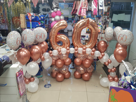 60th birthday rose gold and white two balloon bouquets with foils, balloon columns and table arch
