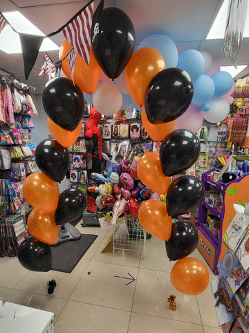 Black and orange string of pearls balloon arch