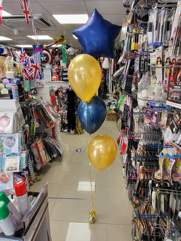 Navy blue and gold three balloon bouquet with added star foil