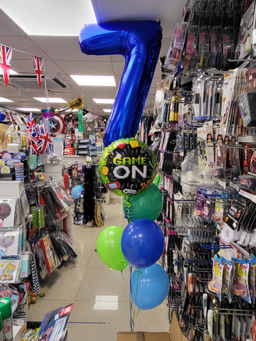 Blue and green 7th birthday gamer four balloon bouquet with added foils