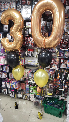 Black and gold 30th birthday two balloon bouquets with added foil numbers