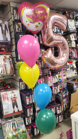 Rainbow four balloon bouquet with attached unicorn foil balloon and Rose gold pink number five balloon