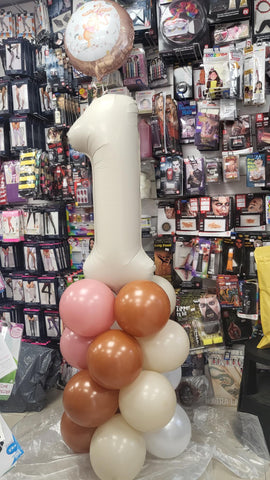 Neutral first birthday balloon column with added Winnie the Pooh foil
