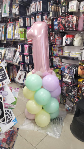 Pastel first birthday balloon column