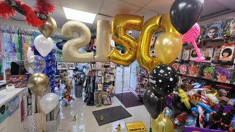 Cream and gold 21st birthday balloon bouquet and numbers with gold and black 50th birthday bouquet and balloon numbers