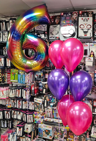Rainbow splash number 6 foil balloon with two pink and purple three balloon bouquets