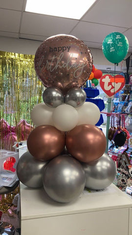 Rose gold and silver happy birthday balloon pyramid