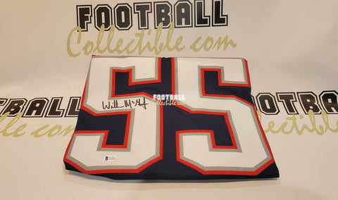 Willie McGinest framed autographed blue jersey