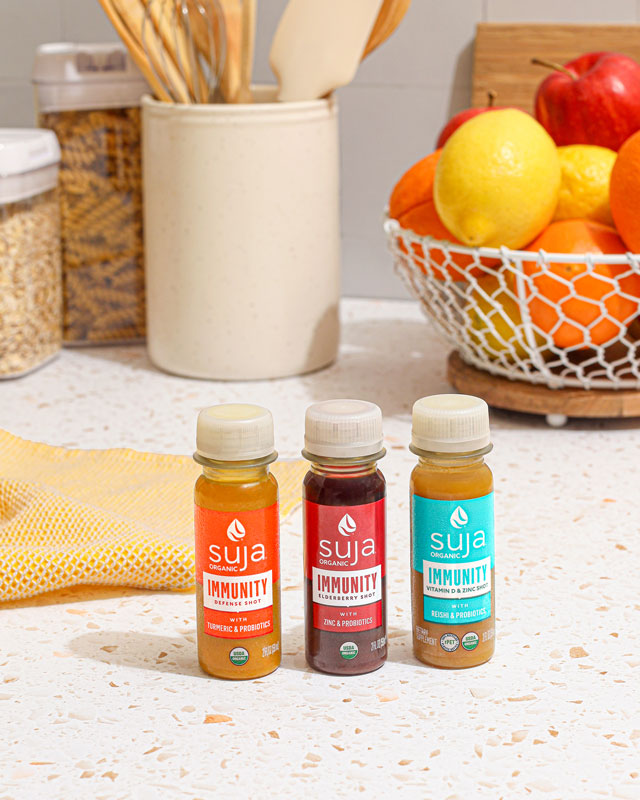 Suja immunity defense wellness shots in hands