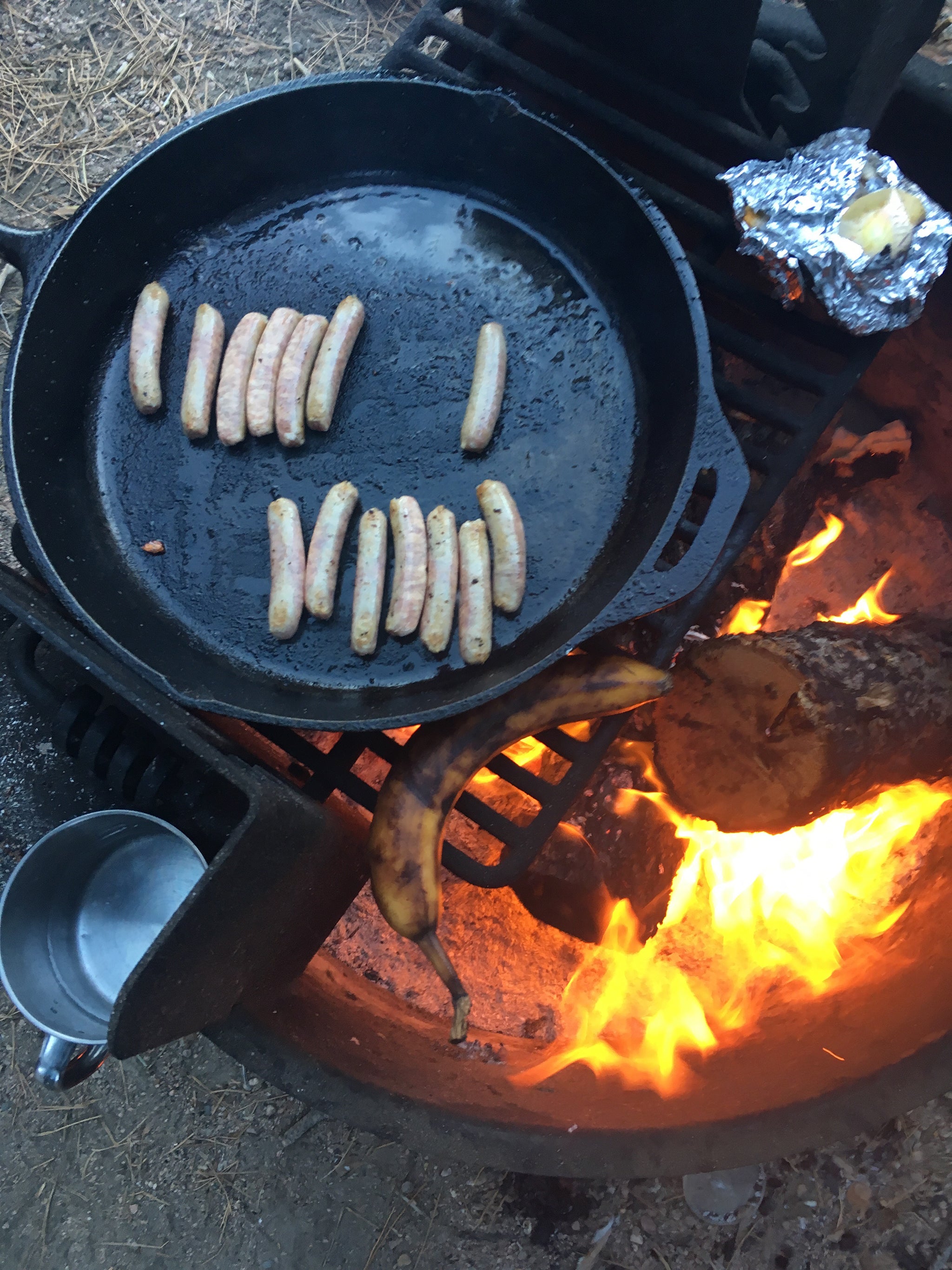 sausages cooking in a pan