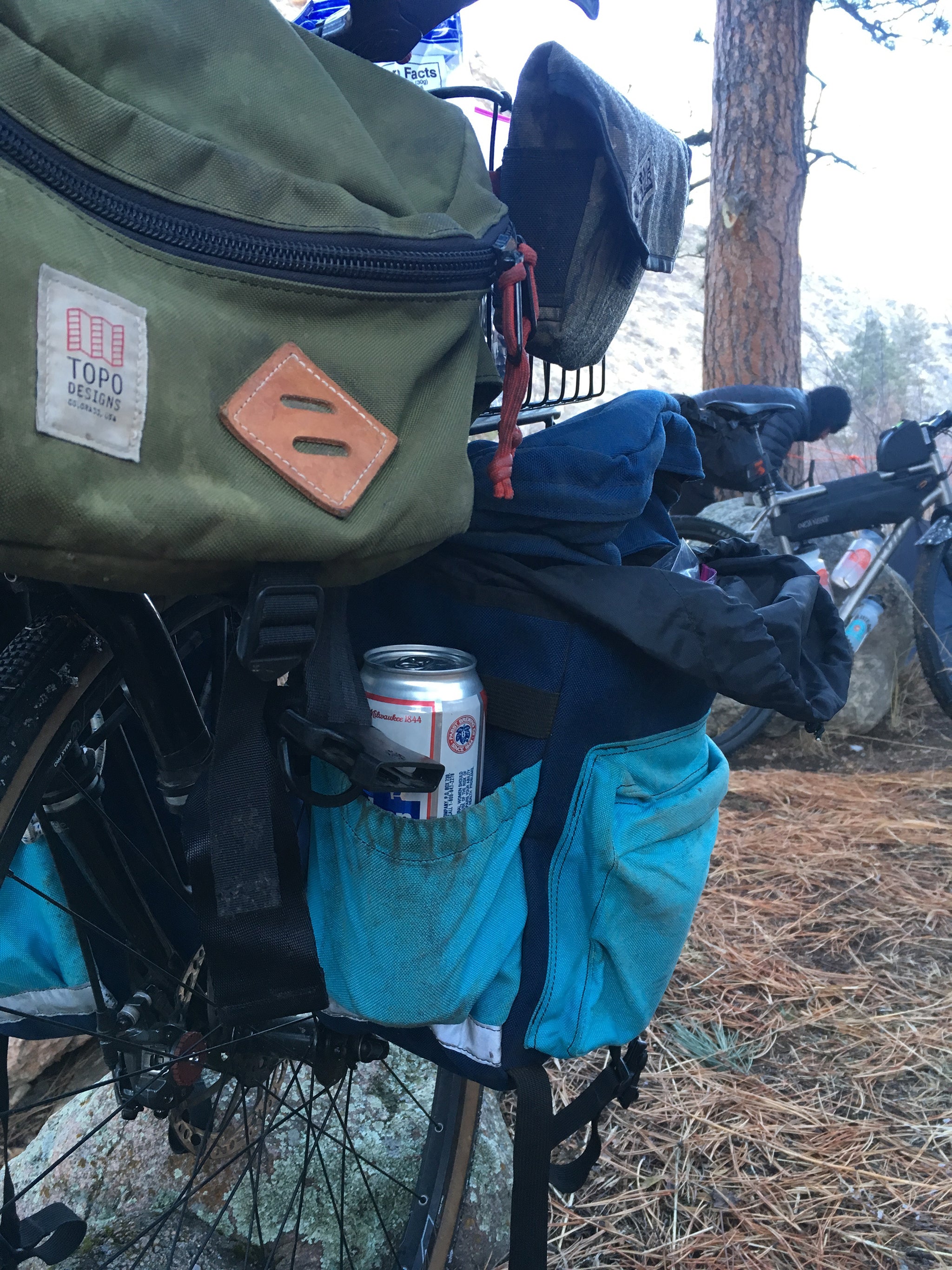 packed camping gear on bike
