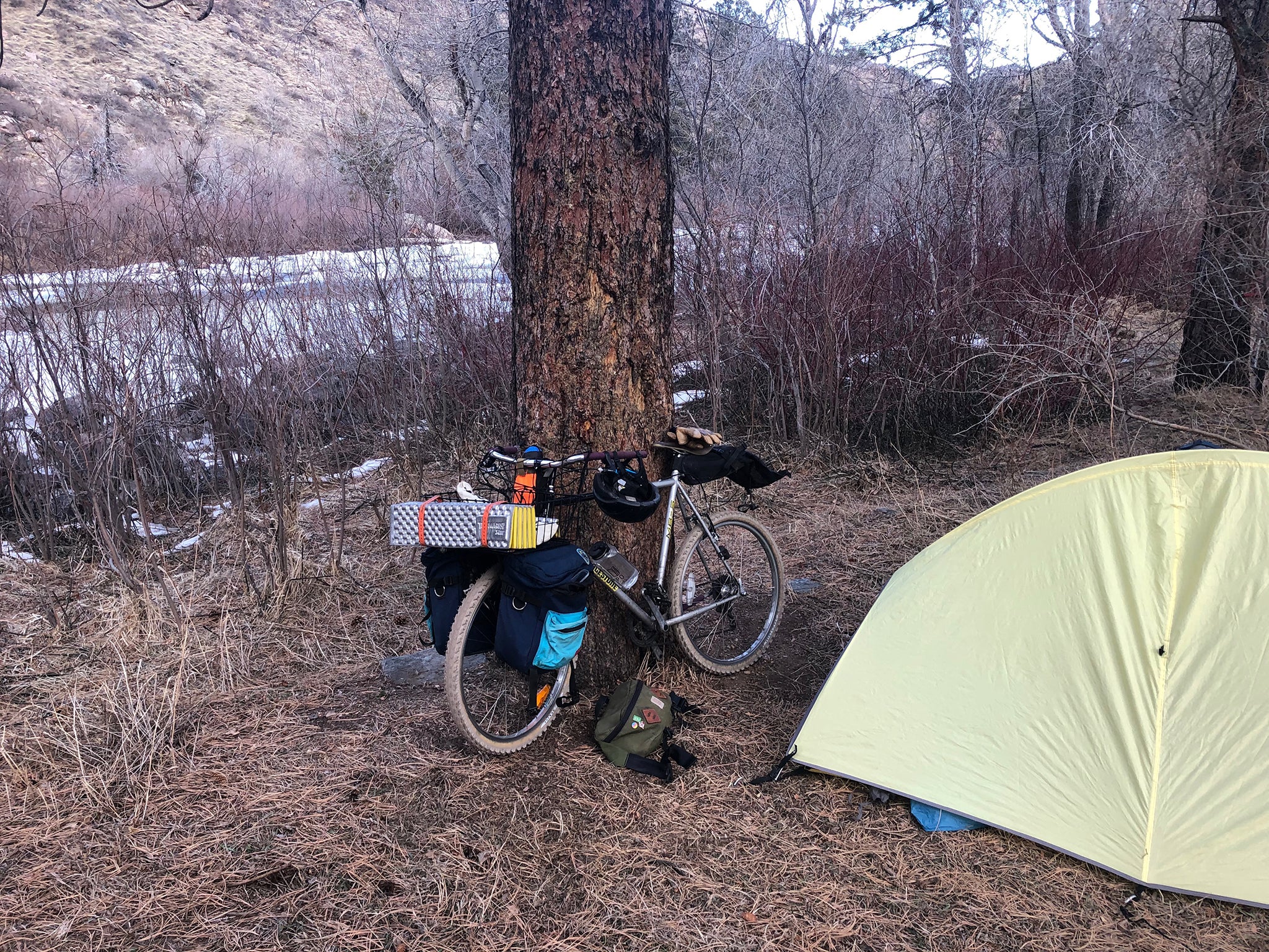 packed out bike next to tent