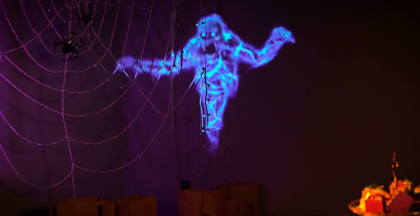 Yaber Halloween decoration ideas. A moving ghost is projected by a projector on the wall. 