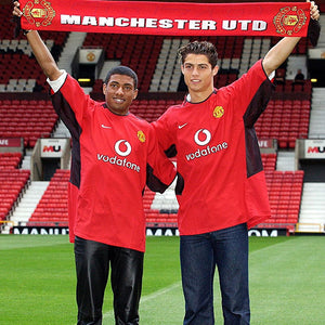 Cristiano Ronaldo Manchester United sports top raising arms with scarf