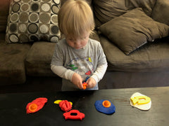 child playing with play dough