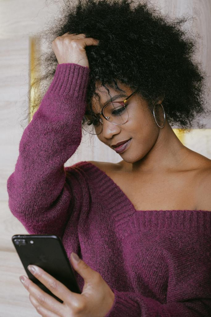 woman in purple off-shoulder knit sweater 