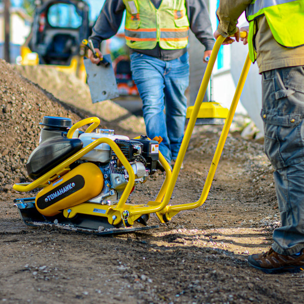 Man using a 5.5 HP Honda Plate Compactor Tamper Asphalt Compaction from Tomahawk Power 