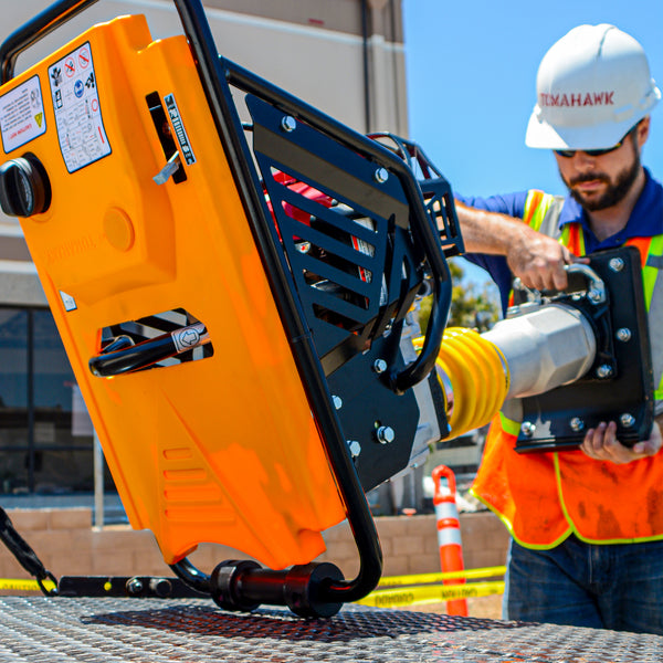 Construction worker using 3 HP Honda Vibratory Rammer Tamper with Honda GX100 Engine 3350 lbs/ft from Tomahawk Power