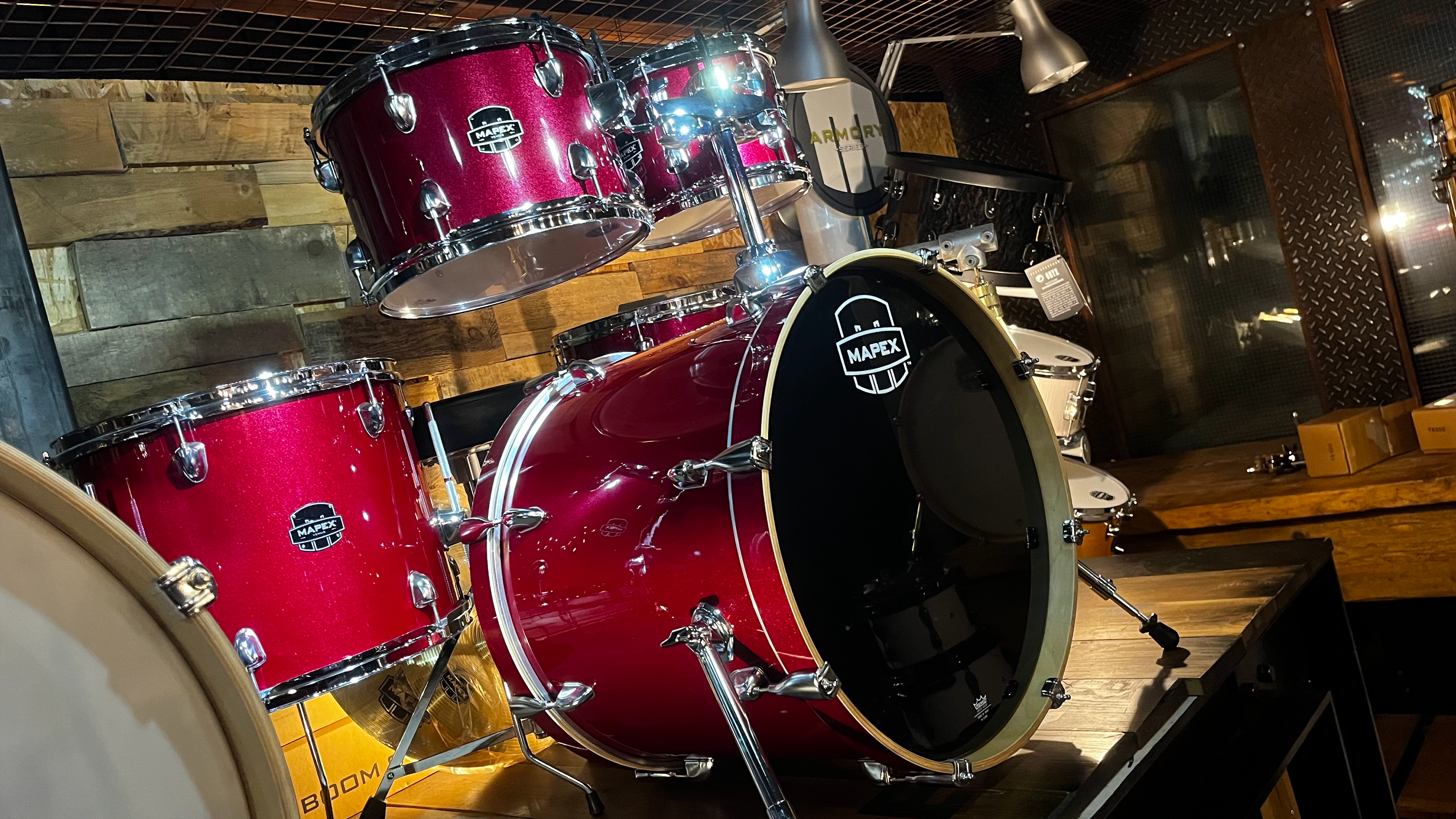 Mapex drum kit with a sparkly red finish and wood hoops