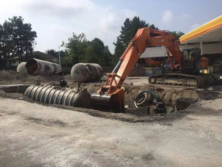 Excavator digging a trench