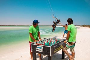 foosball on beach with kitesurfer