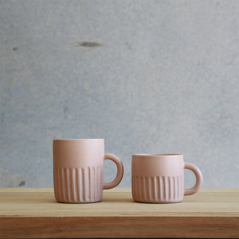 Arcadia Scott Ceramics' Fluted Mug (left) and Fluted Cup (right) in Blush glaze