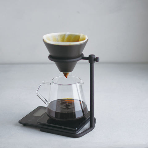 Kinto's SCS Pourover Coffee Stand Set as delicious coffee drips through into the clear glass jug
