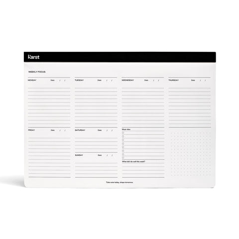 Karst's Weekly Desk Pad, an A4 landscape pad with a black top-binding and sections for each day of the week