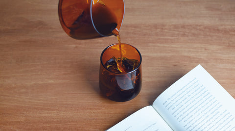 A Sepia Jug pouring coffee into a Sepia Tumbler