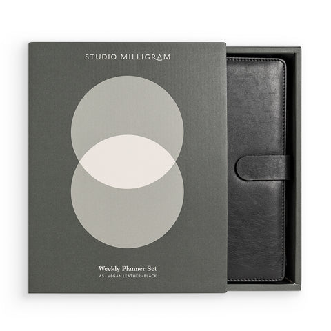 Studio Milligram's A5 Planner in Black, presented in a gift box