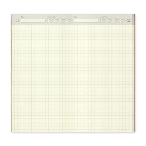 Traveler's Notebook Undated Diary Refill, shown open with grid pages on display. At the top is a grey bar for the date.