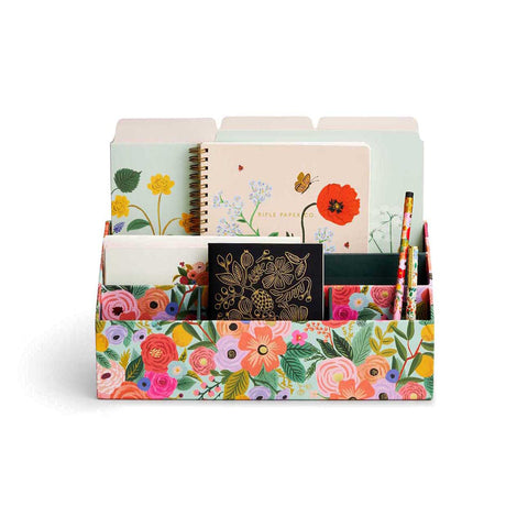 Rifle Paper Co. Desk Organiser | Milligram [img: a small storage box with multiple compartments holds notebooks, file folders, pencils and more. The storage box is wrapped in a floral print]