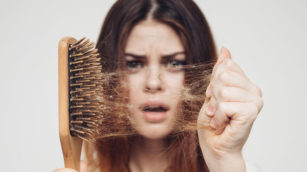 woman suffering from DHEA hair loss