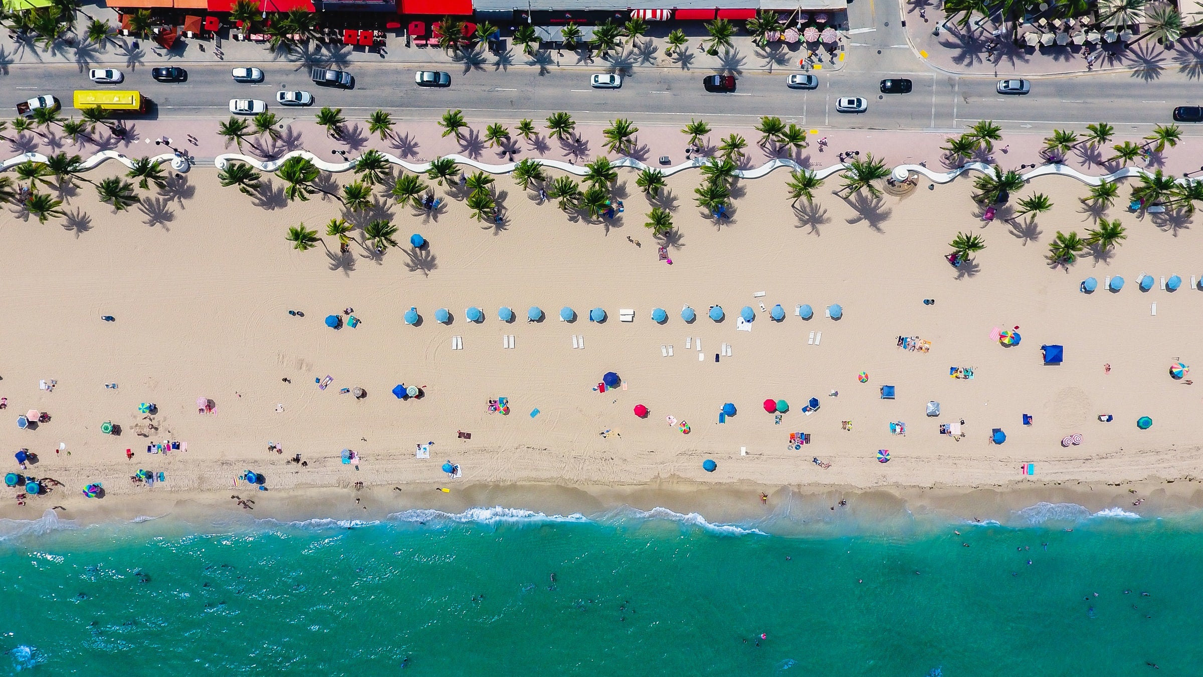 Beach top down picture with sand, road, sea salt water