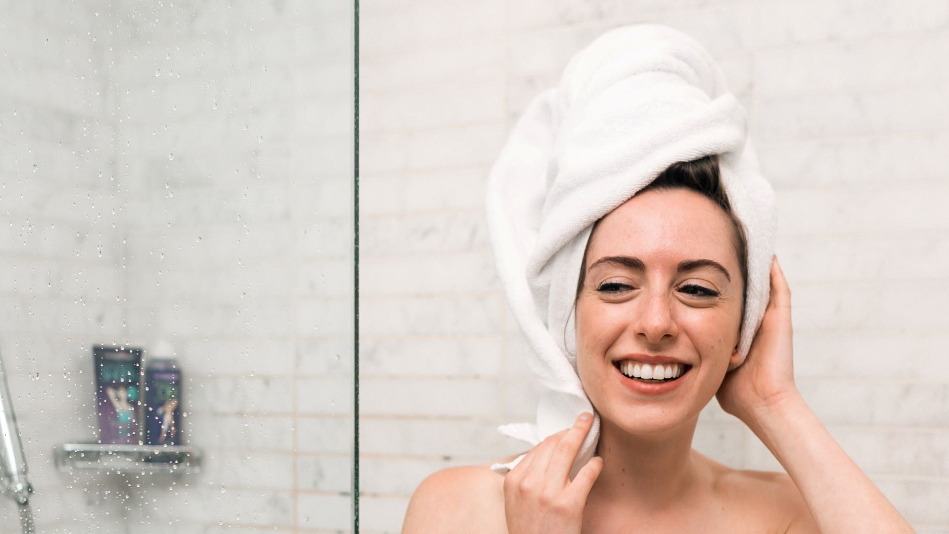 a woman out of the shower protecting hair from falling