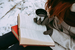 Cosy Glove and a book with a coffee 
