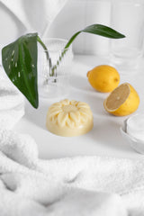 Hand Balm in bathroom with lemons and green plant