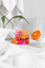 Sweet Orange Blossom Pink & Orange Sea Salt Body Scrub, in bath room with oranges 