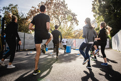 men and women exercising outside