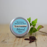 Minty Cocoa Lip Balm With Real Mint & Chocolate on a wooden slab