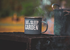 cup of tea in a mug in the garden