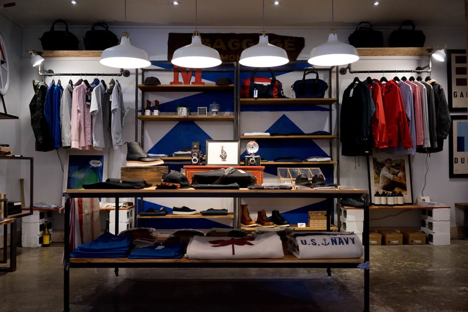 Men clothing shop, casual clothes on hangers and shelves in