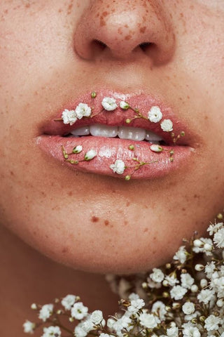 Flowers on woman lips