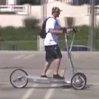 StreetStrider CEO Garrett Watkins riding a prototype in California || half-image