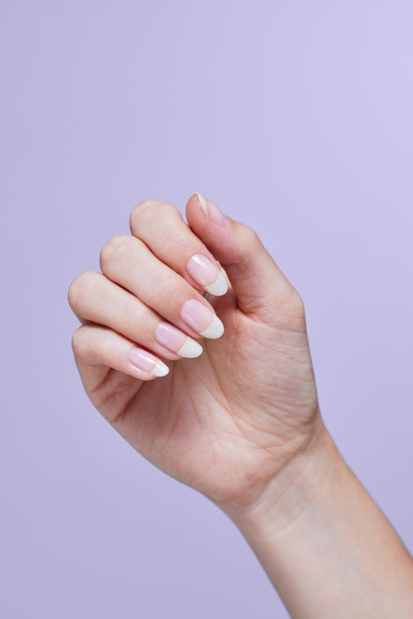 A hand in a loose fist with natural healthy nails