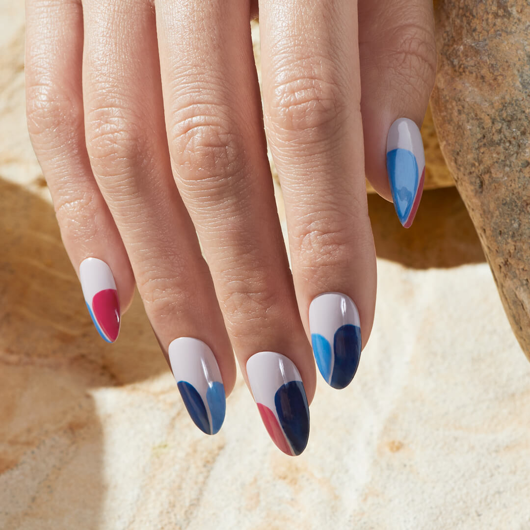 Hand with blue and pink nail art