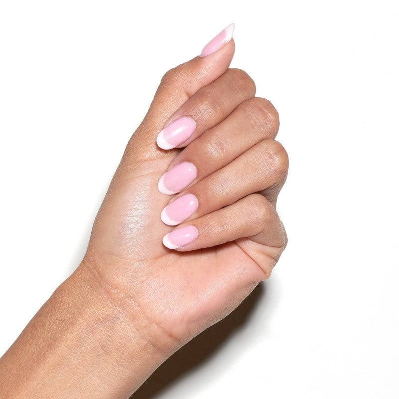 Hand showing a classic french manicure