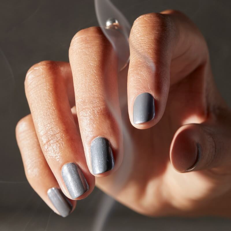 Hand with grey shimmer nails