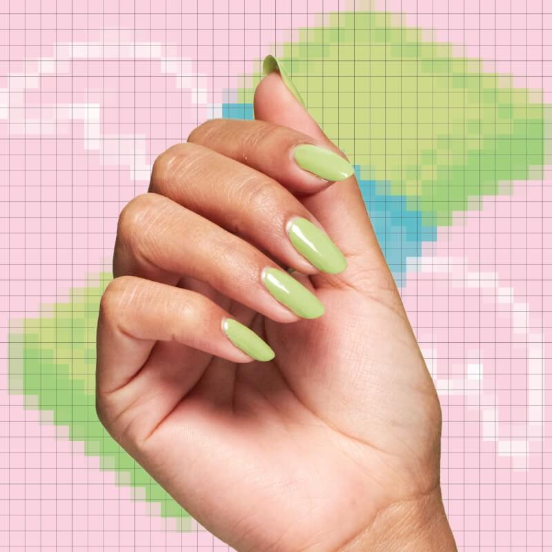 Hand showing pastel green nails with pixelated background