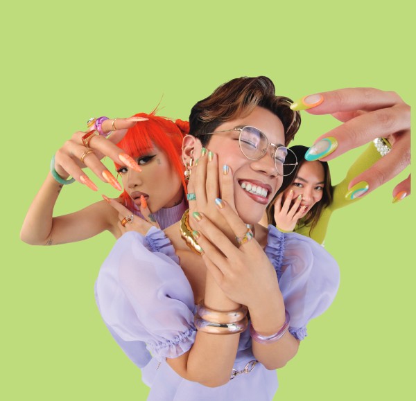 three people show off their OPI nail art with green background